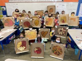 The third graders practiced fractions this week by making pizza box fractions